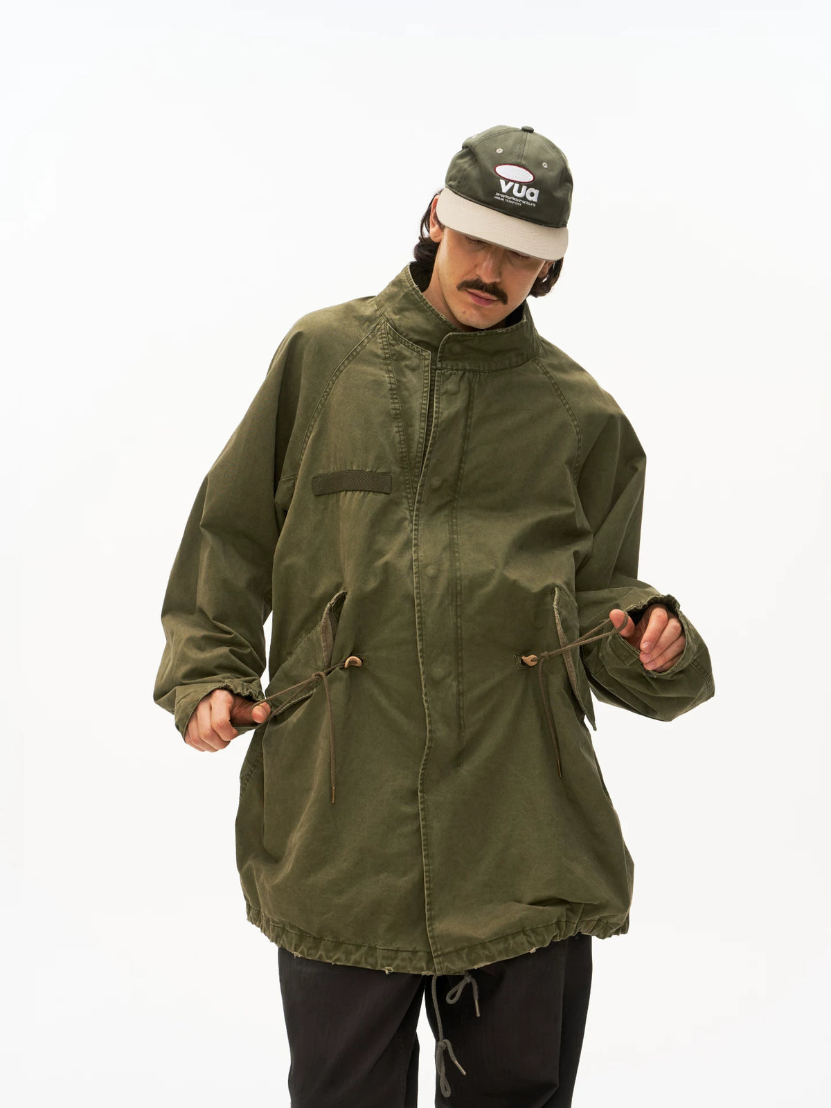 Olive M65 fishtail parka worn on model, front view