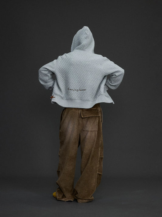 Chaqueta con capucha y cremallera bordada
