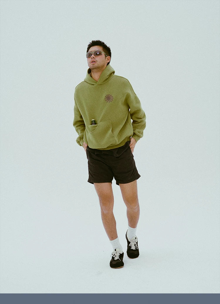 Full-length view of the olive cotton hoodie