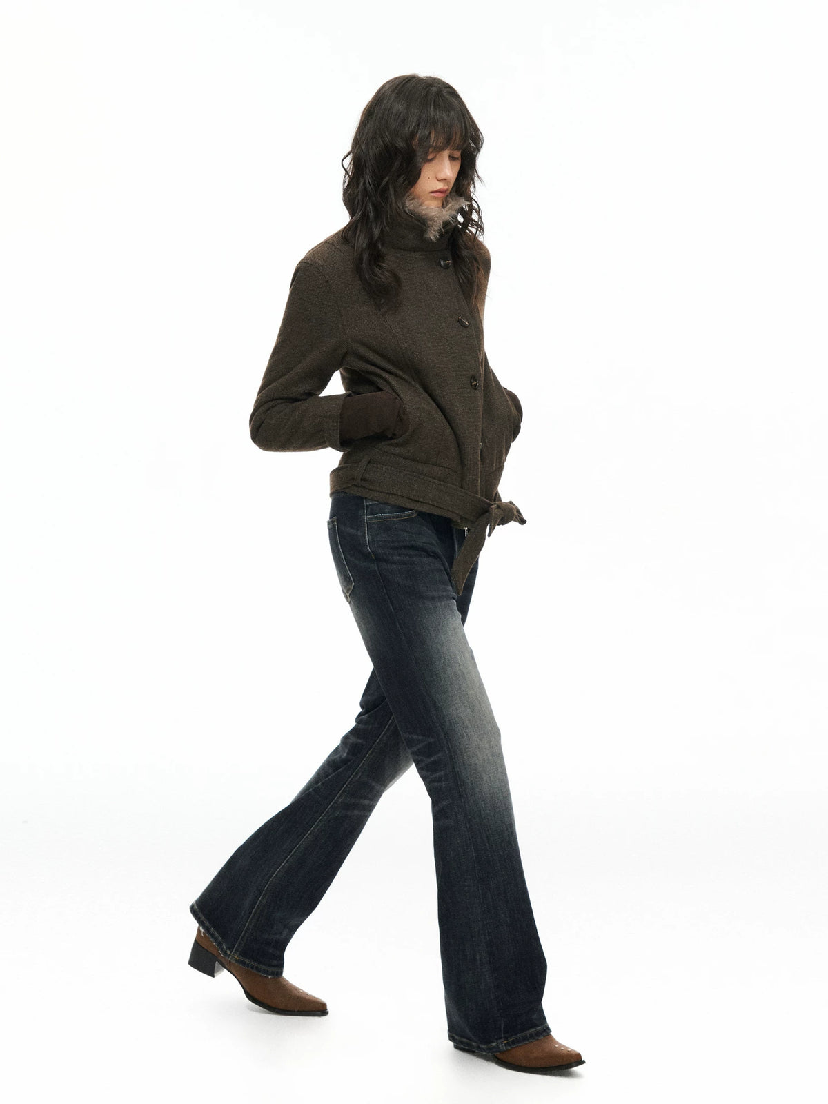 Brown belted jacket worn, side view with jeans