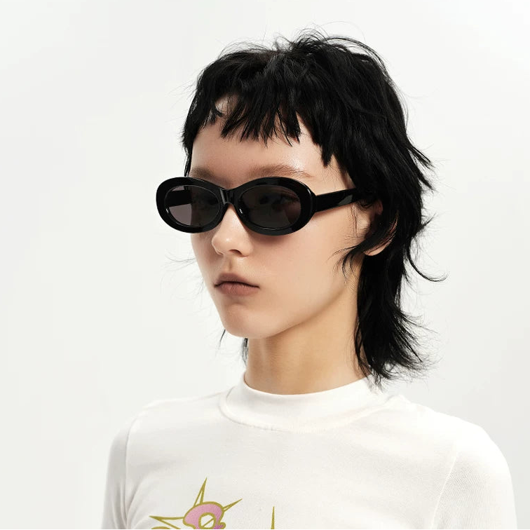 Chunky Oval Sunglasses — Model wearing black chunky oval sunglasses