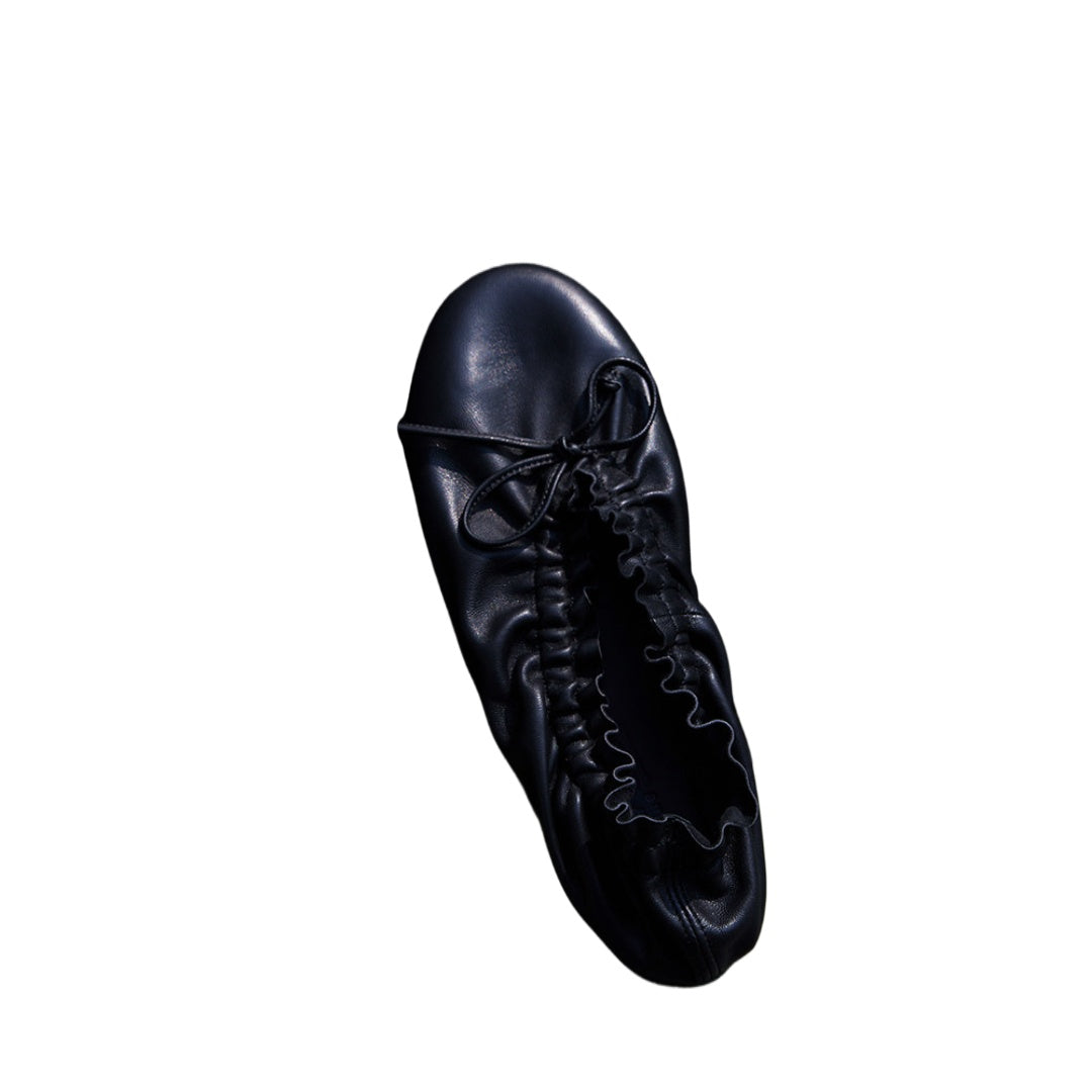 Crinkled Lambskin Folding Ballet Flats — black pair, top view