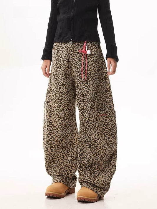 Unisex Leopard Print Statement Wide-Leg Scimitar Pants — worn by a model