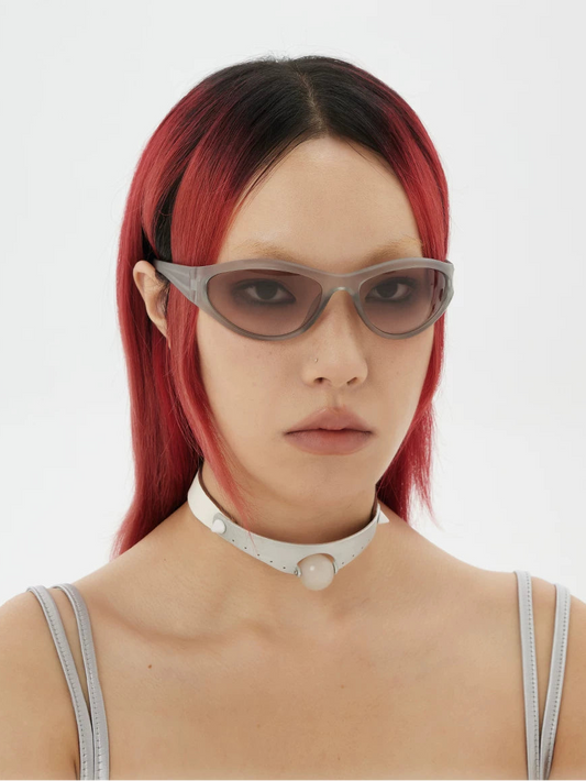 Futuristic Oval Sunglasses — Model wearing oval sunglasses with brown tinted lenses