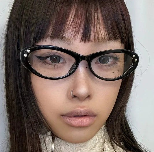 black upswept cat-eye clear-lens glasses on model
