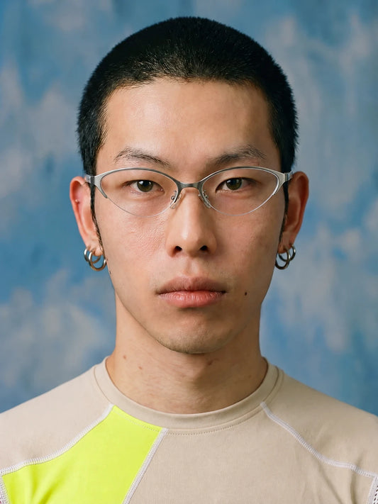 Model wearing silver-tone metal cat-eye glasses, front view