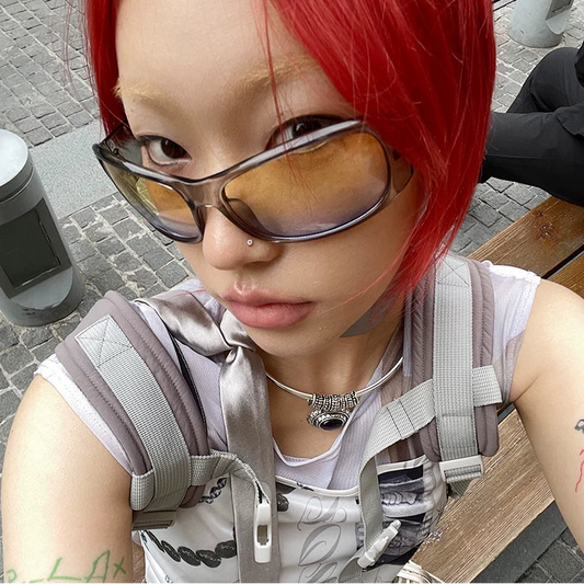 Oversized Sport-Inspired Sunglasses — Model wearing oversized sunglasses, selfie