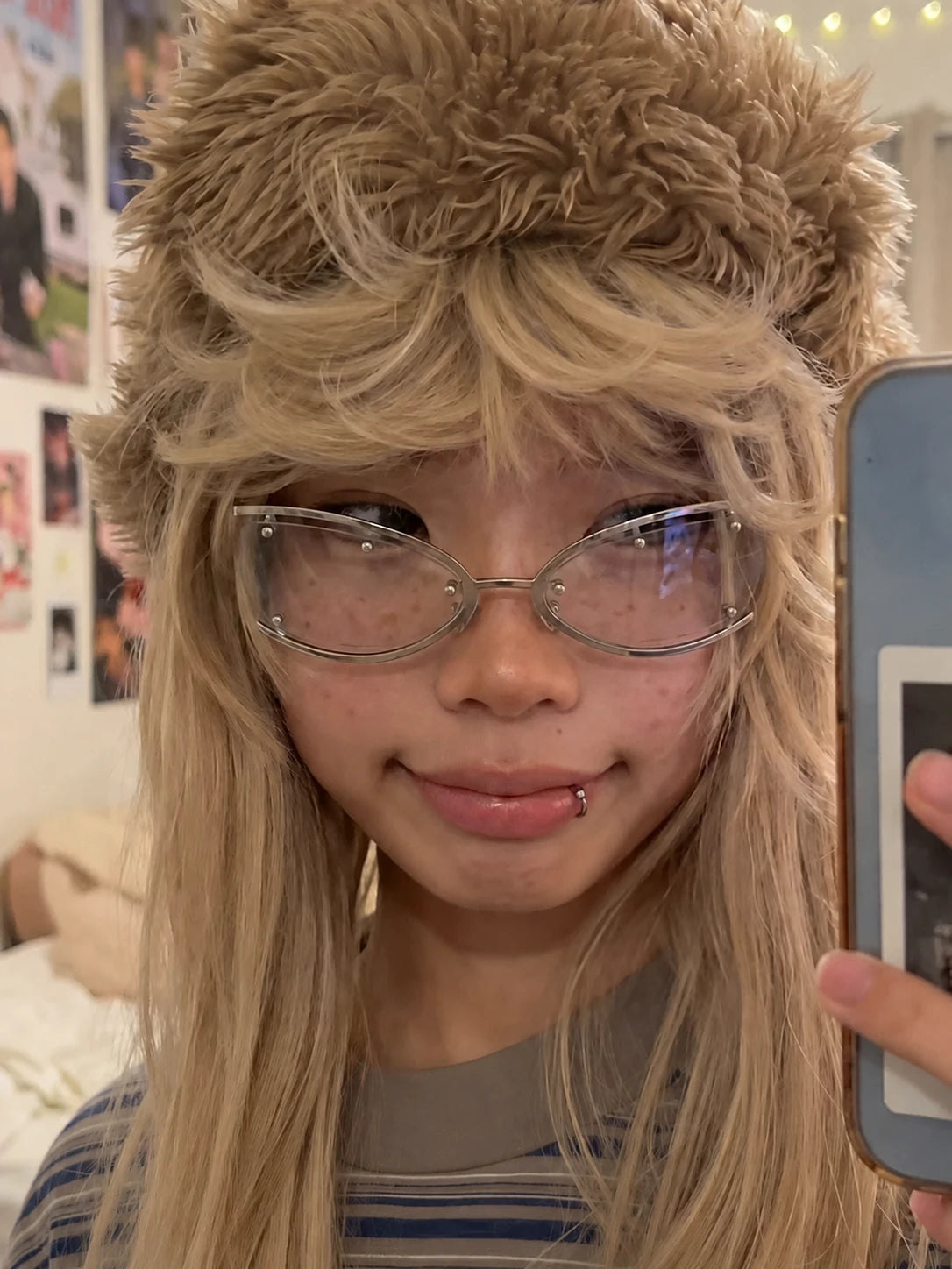 Mirror selfie of a model wearing silver Retro Rectangular Metal Glasses and a brown furry hat