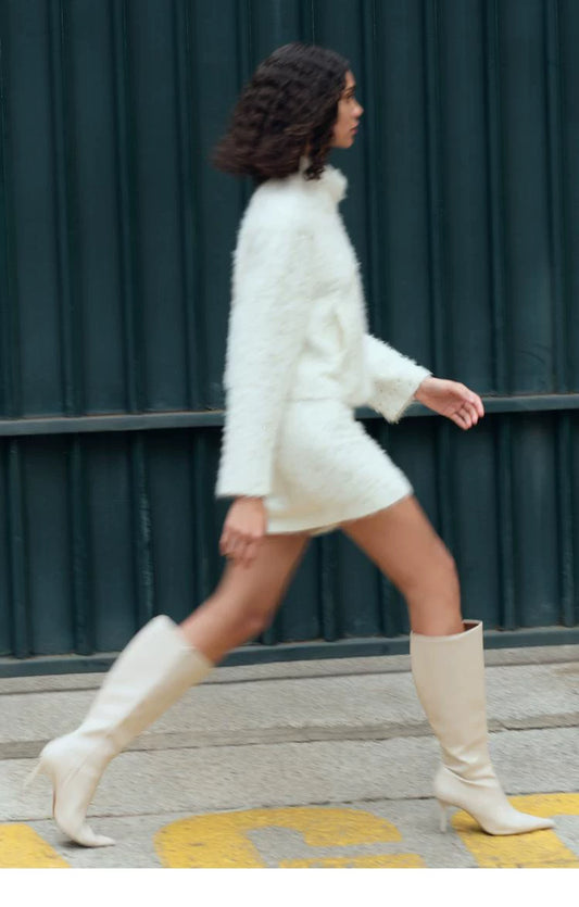 Women's Leather Pointed-Toe 8cm Stiletto Knee-High Boots — model wearing cream boots with white outfit
