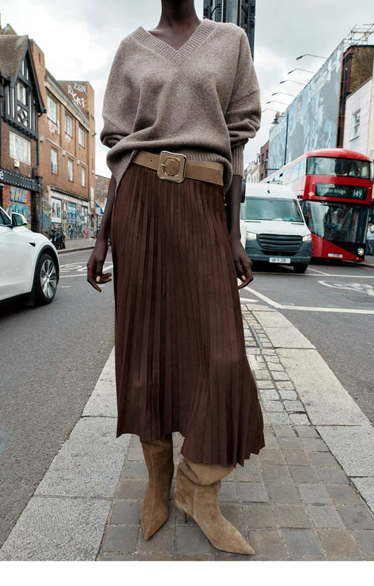 Women's Suede Pointed-Toe 8cm Stiletto Knee-High Boots — model wearing tan boots with pleated skirt