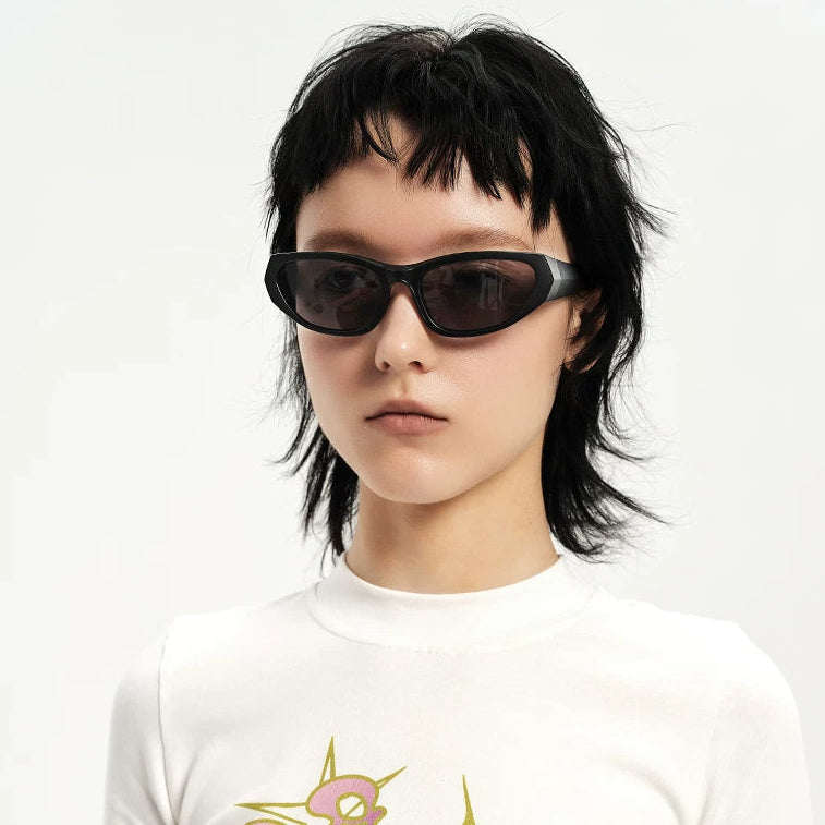 Y2K Angular Wraparound Sunglasses — Model wearing black wraparound sunglasses