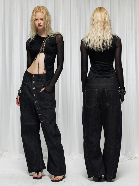 Two models in black baggy button-fly jeans