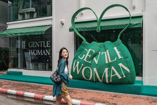 Gentlewoman Bangkok storefront — giant green bag sculpture and shopper