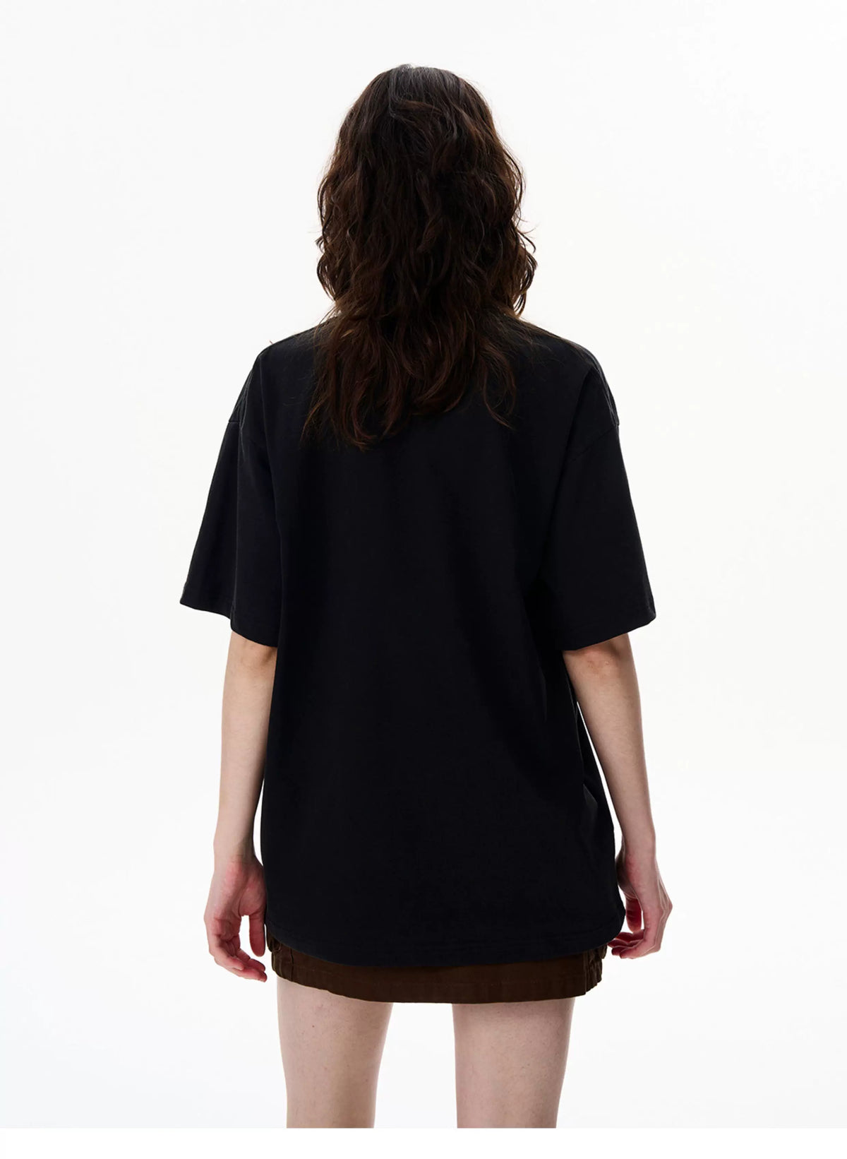 Washed black vintage washed graphic T-shirt worn by a model - back view