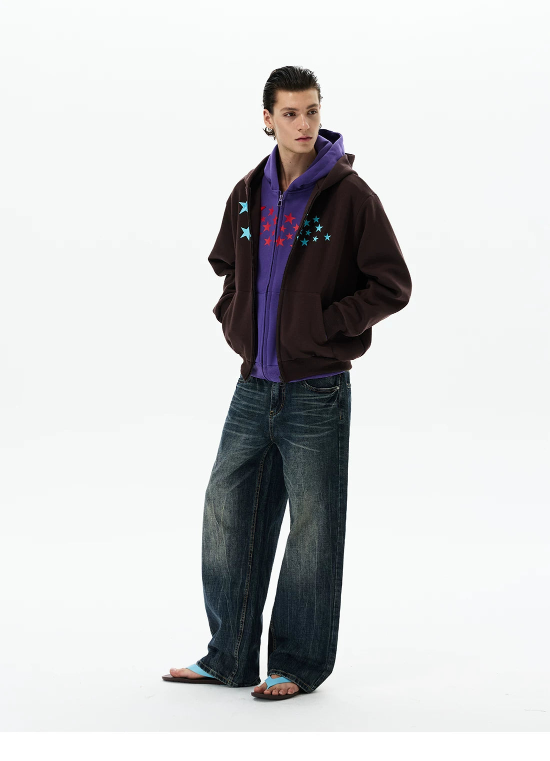 Purple hoodie under brown jacket, angled view