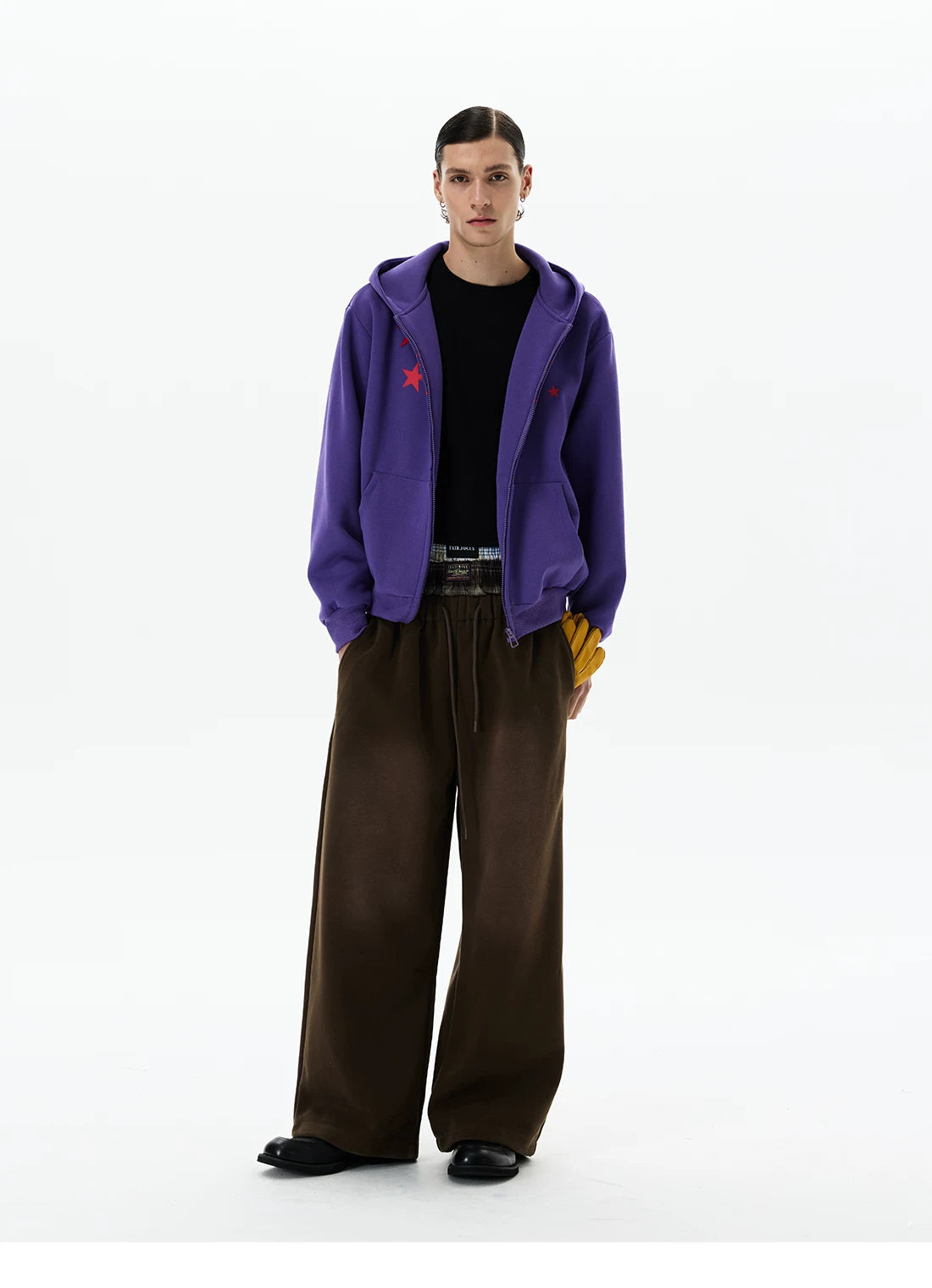 Purple hoodie, full-length front view with brown trousers