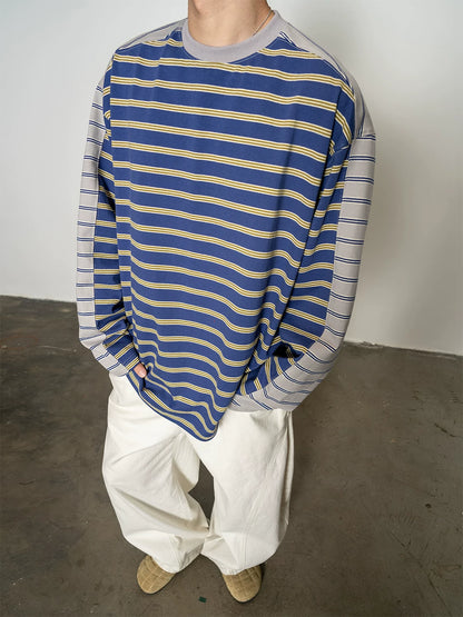 Blue and yellow striped long-sleeve T-shirt, front detail close-up on model