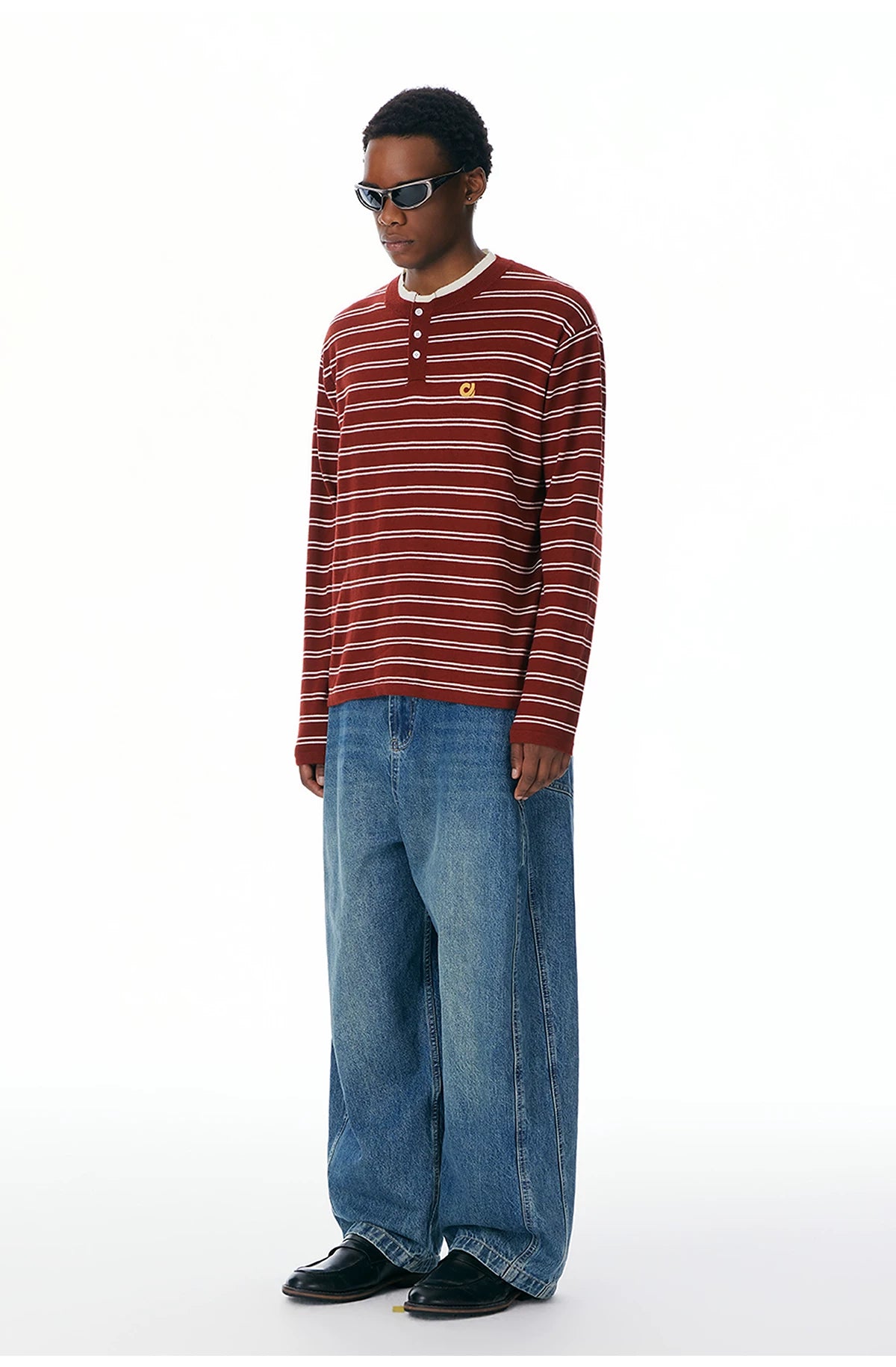 Side view of the red striped Henley sweater