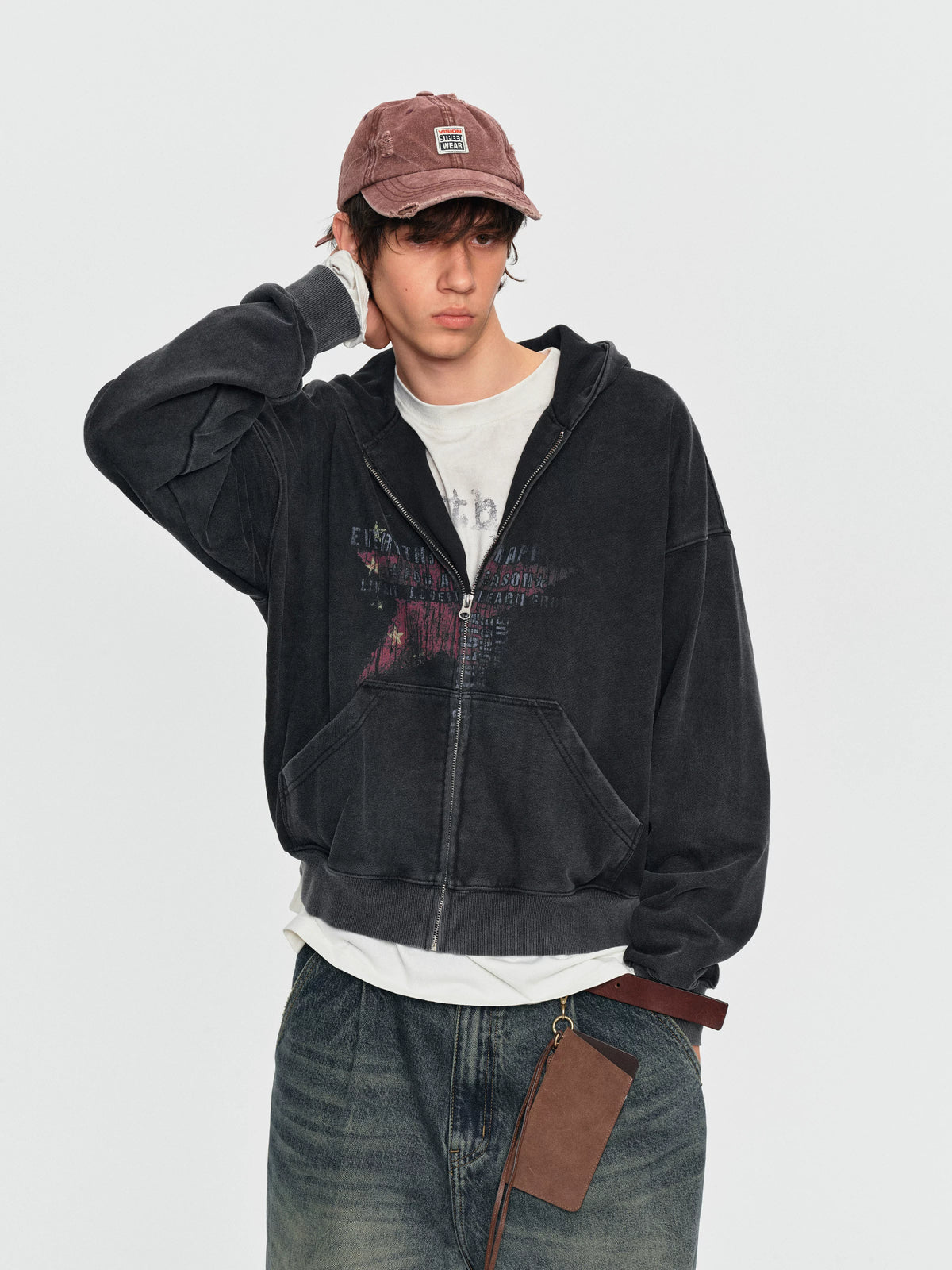Front view of the black star-print hoodie
