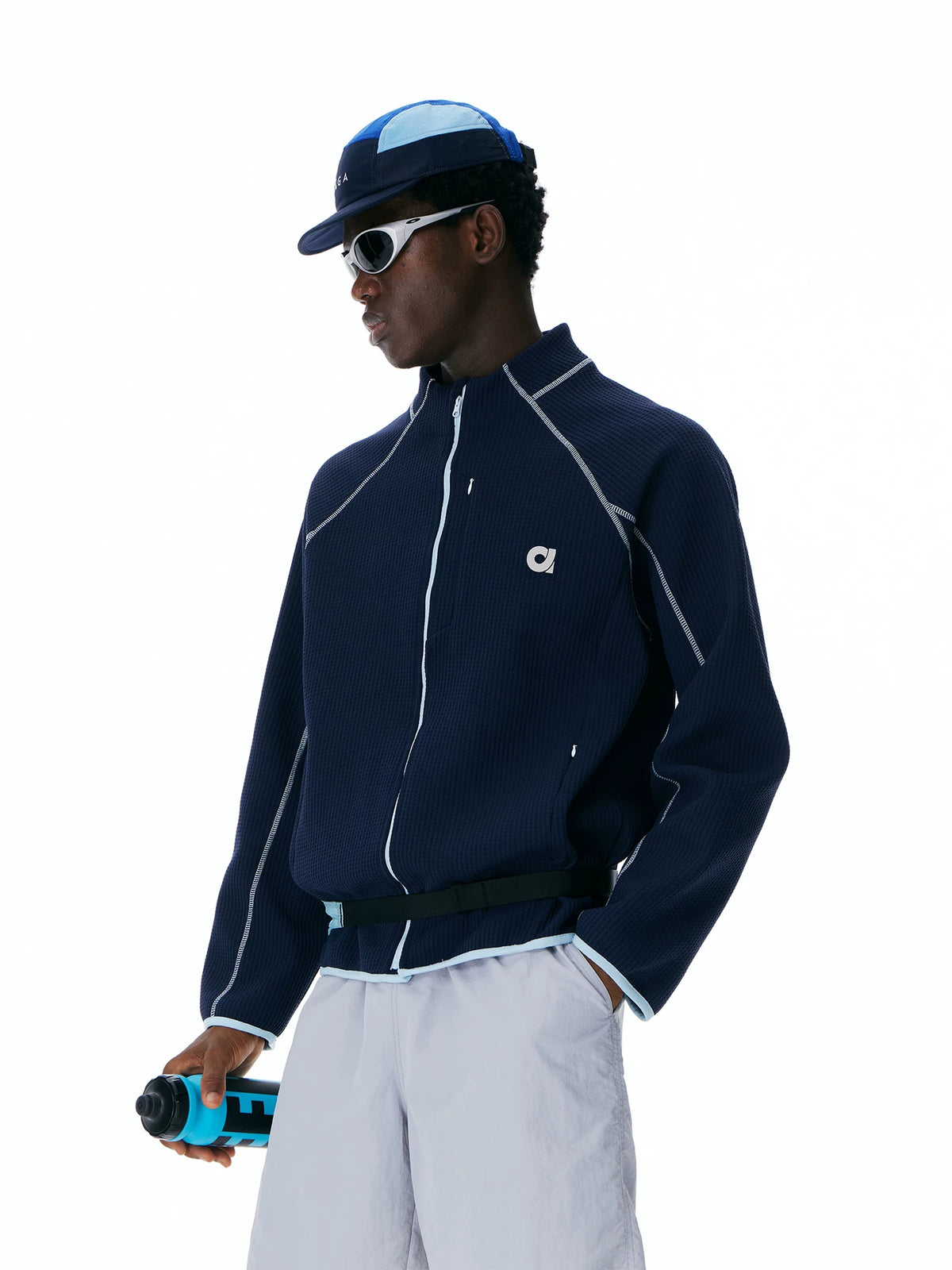 Navy waffle-knit zip track jacket, side view