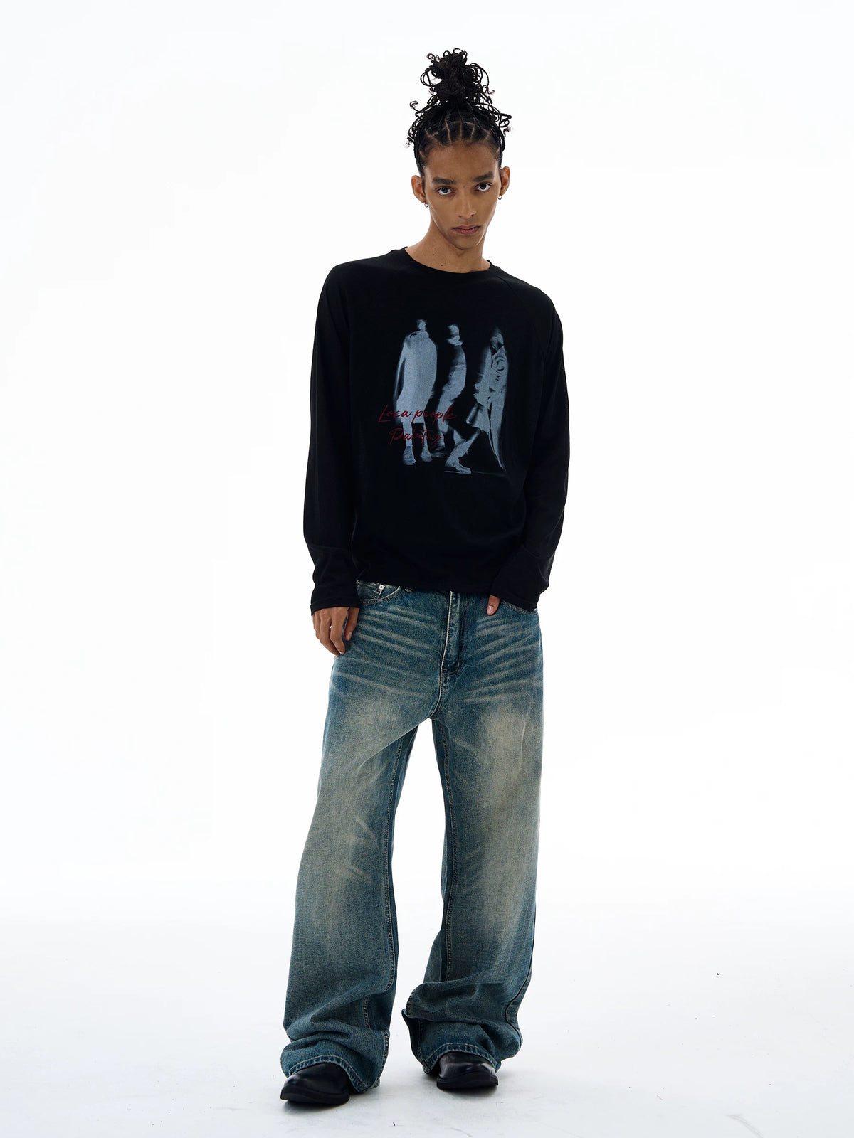 Black graphic T-shirt with jeans, full view