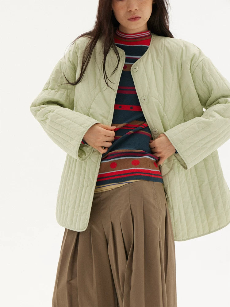 Striped knit sweater in navy, red and green, layered look