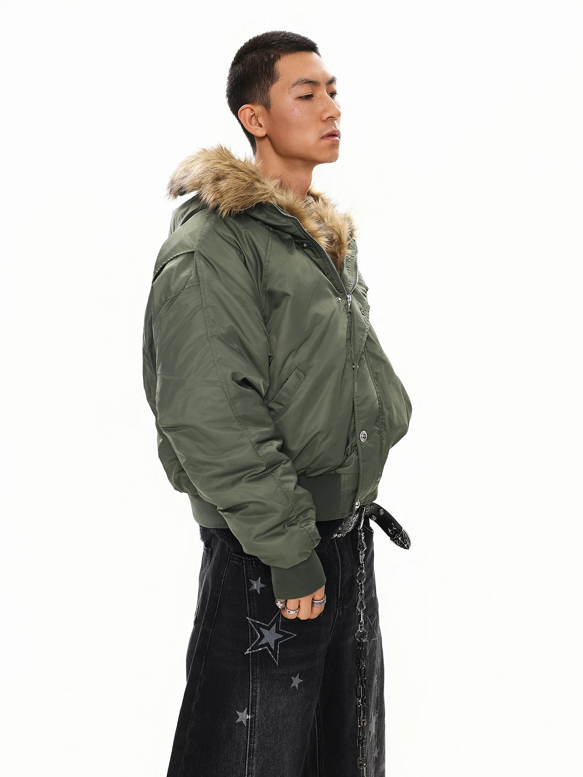 Olive green faux fur hood bomber jacket, side view on model