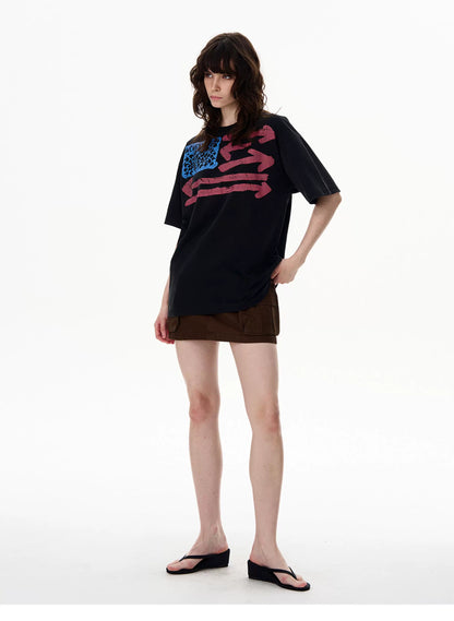 Washed black vintage washed graphic T-shirt worn by a model