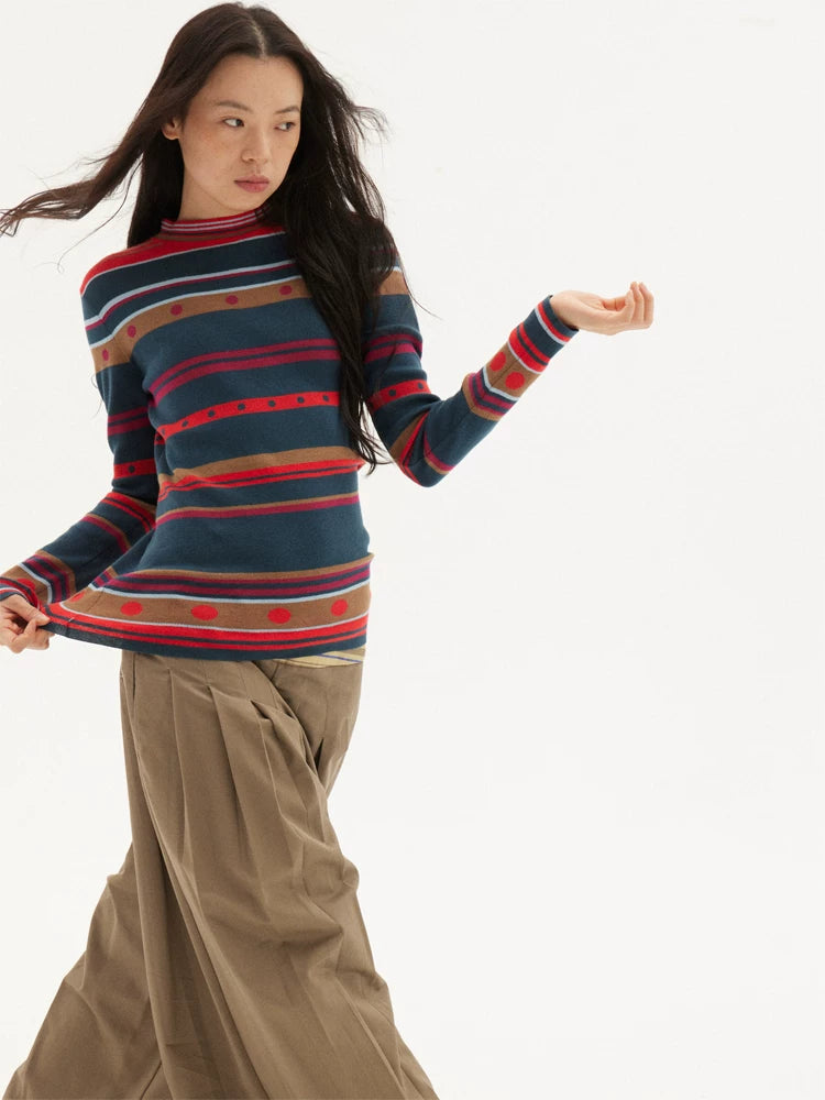 Striped knit sweater in navy, red and green, back view
