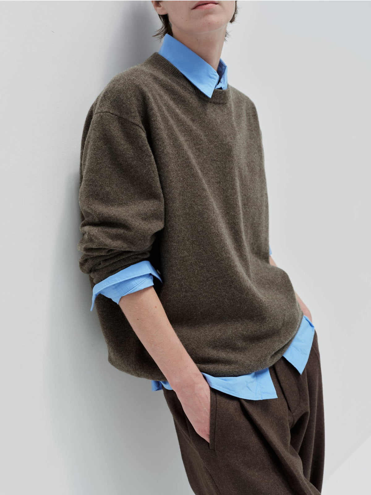 Wool cashmere crewneck sweater, model wearing brown V-neck sweater
