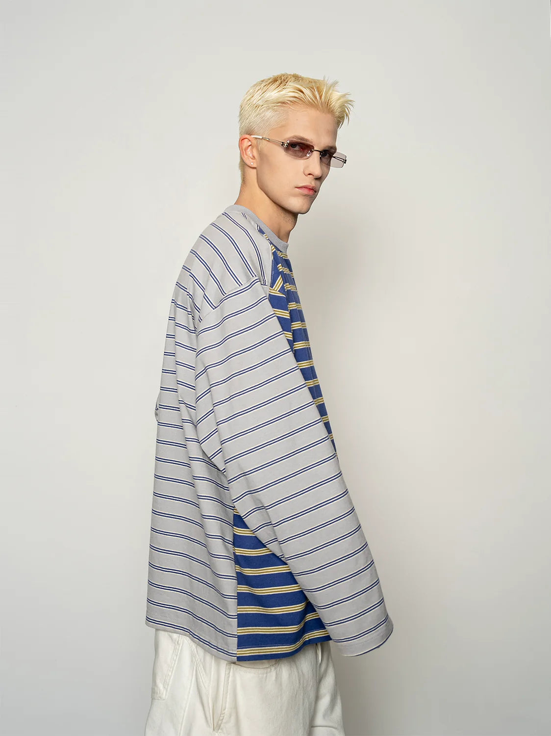 Blue and yellow striped long-sleeve T-shirt, side view on model