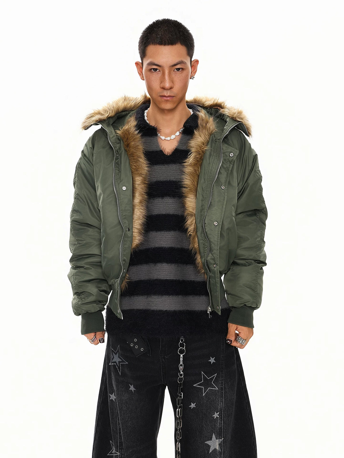 Olive green faux fur hood bomber jacket over striped top, front view on model