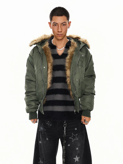 Olive green faux fur hood bomber jacket over striped top, front view on model