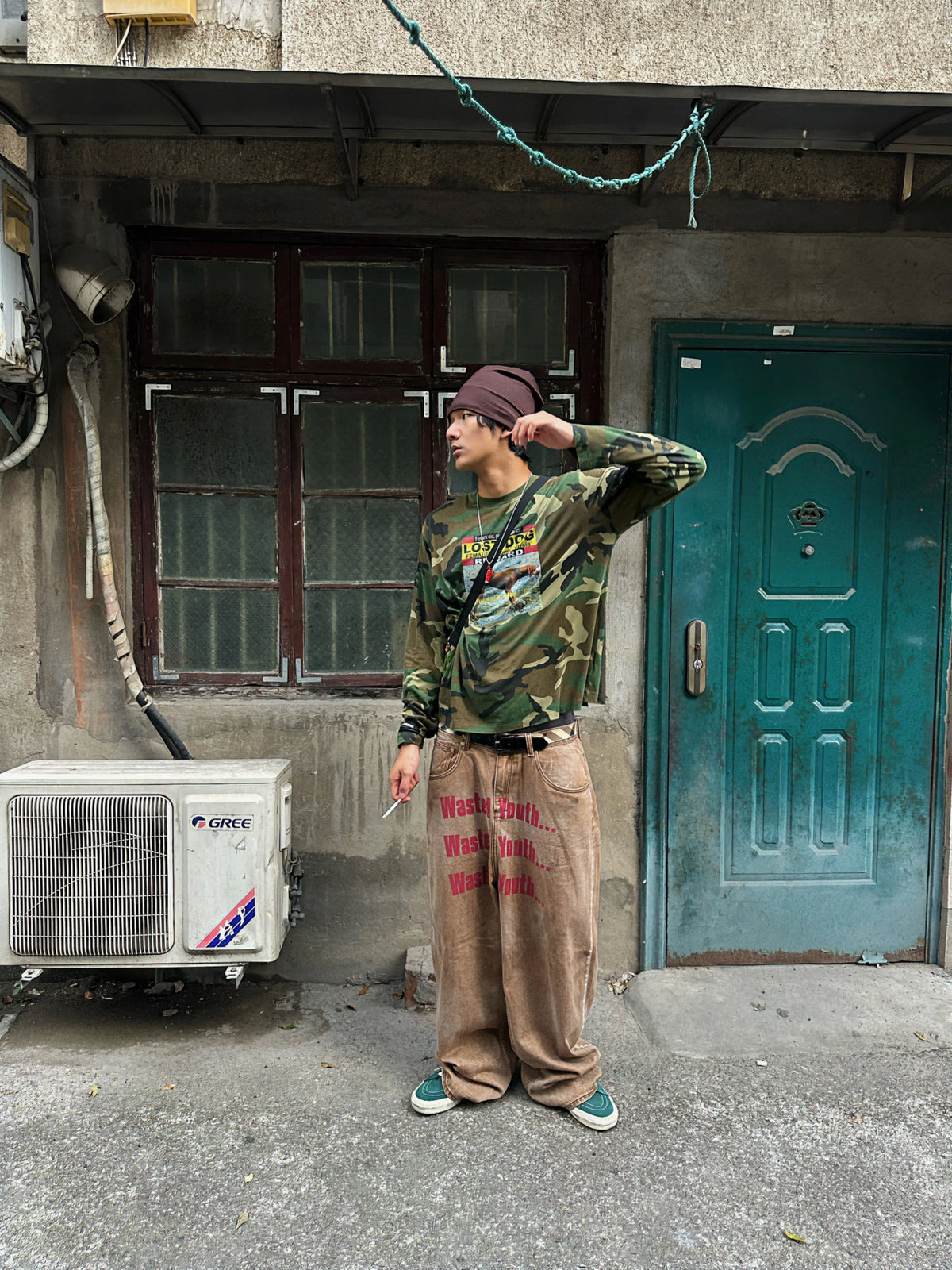 Front view of the camo graphic tee worn by a model
