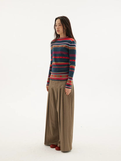 Striped knit sweater in navy, red and green, side view