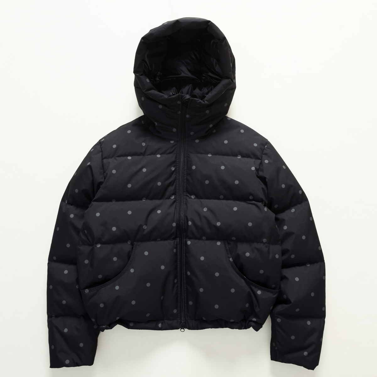 Black and gray dotted hooded puffer jacket, front view