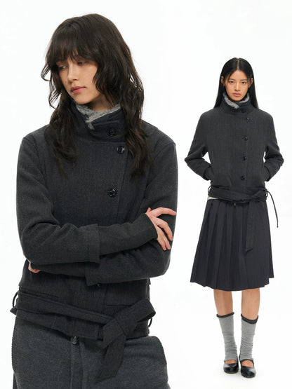 Dark belted jacket worn, front view with skirt