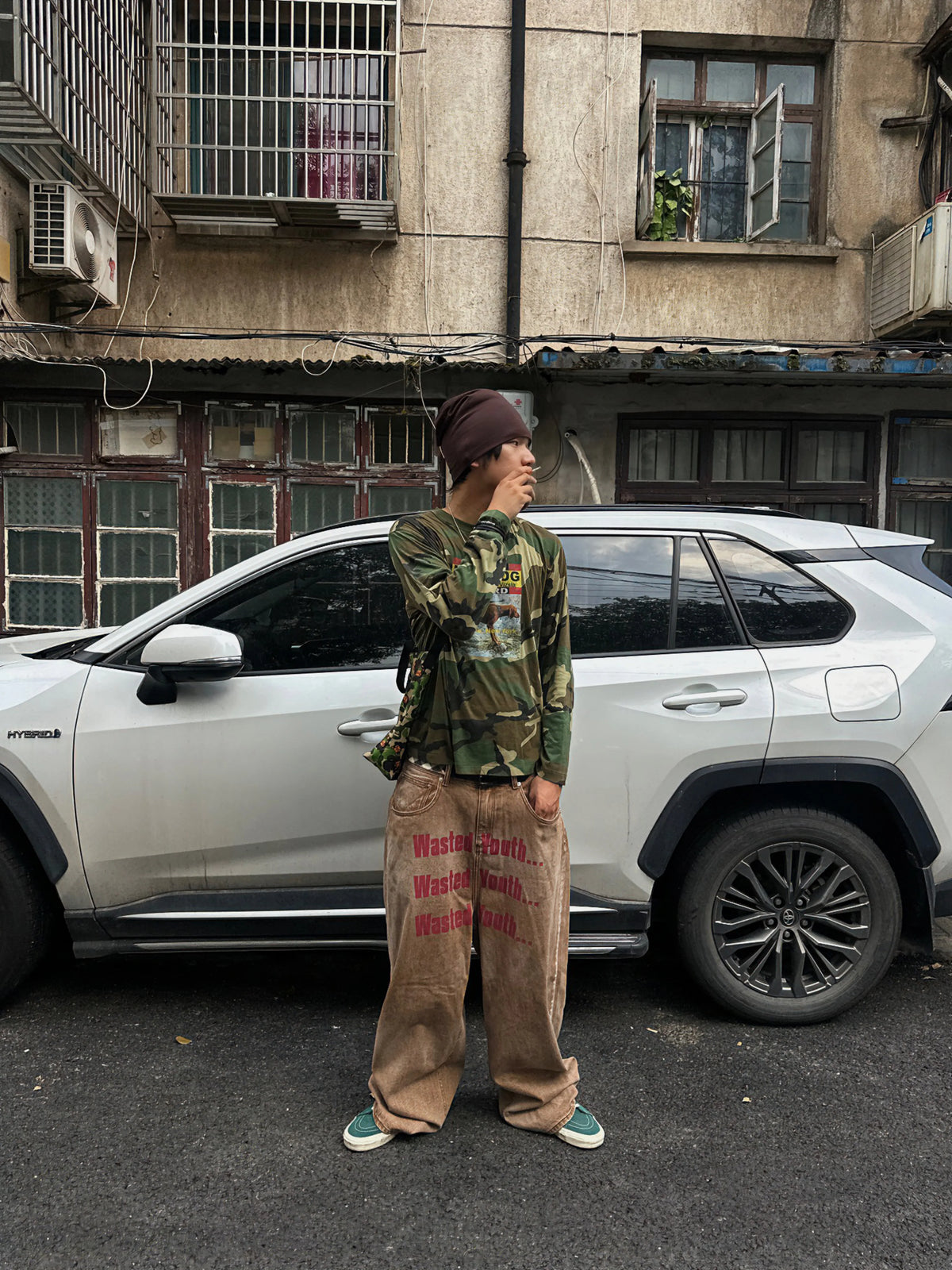 Back view showing the graphic on the camo T-shirt