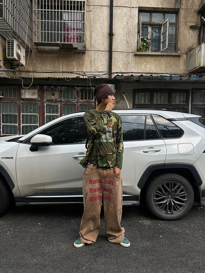 Back view showing the graphic on the camo T-shirt