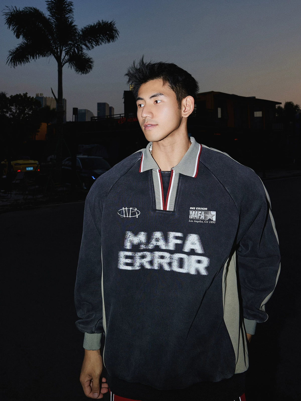 Charcoal pullover sweatshirt with gray sleeves, front view on model