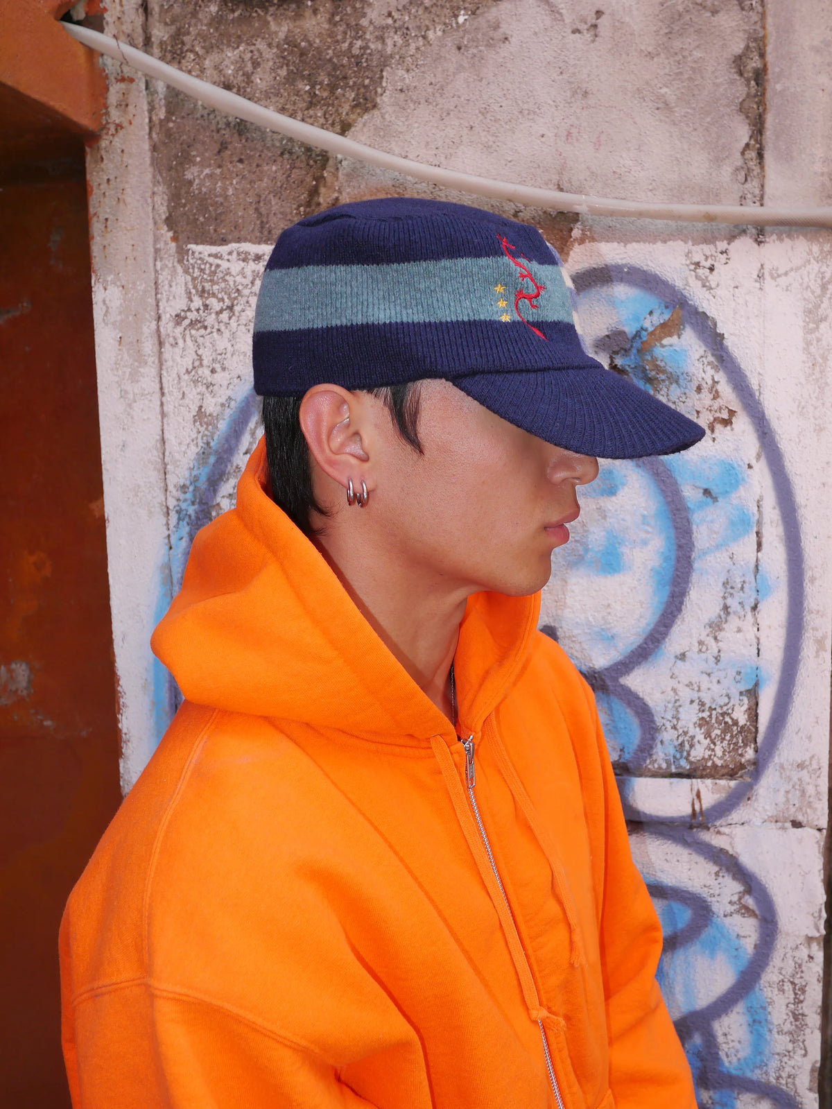 Embroidered Curved-Brim Knit Cap in Navy and Brown color