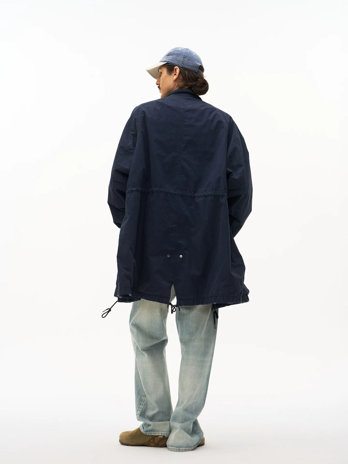 Navy M65 fishtail parka worn on model, back view