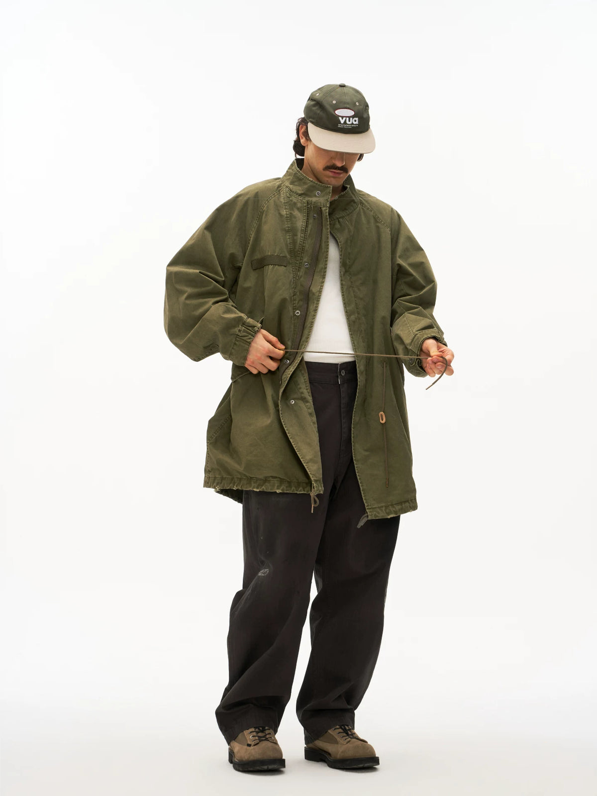 Olive M65 fishtail parka worn on model, front view