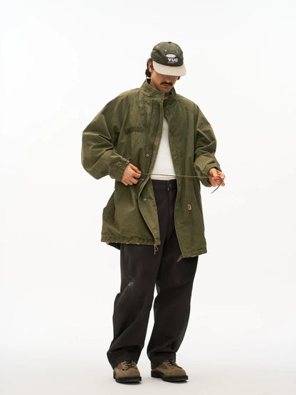 Olive M65 fishtail parka worn on model, front view