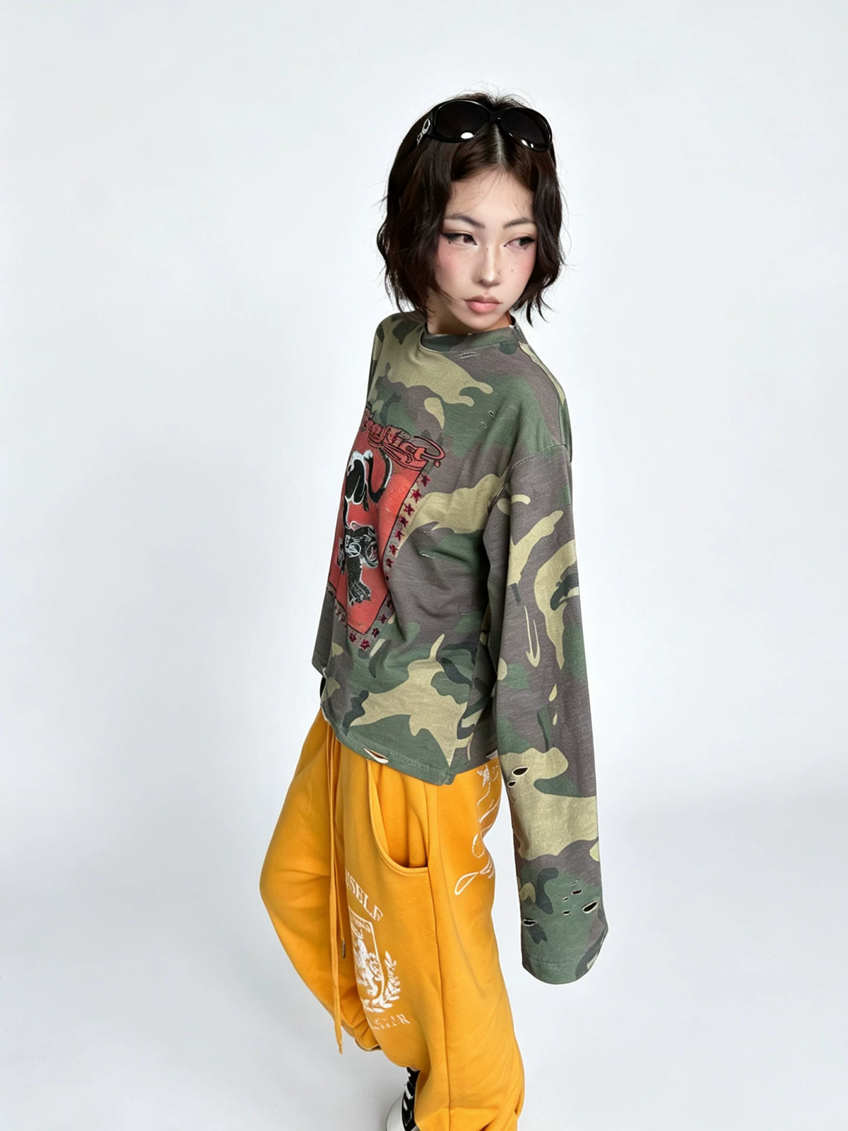 Model wearing the shirt with yellow trousers