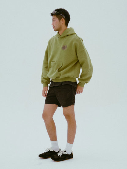 Side view of the olive cotton hoodie