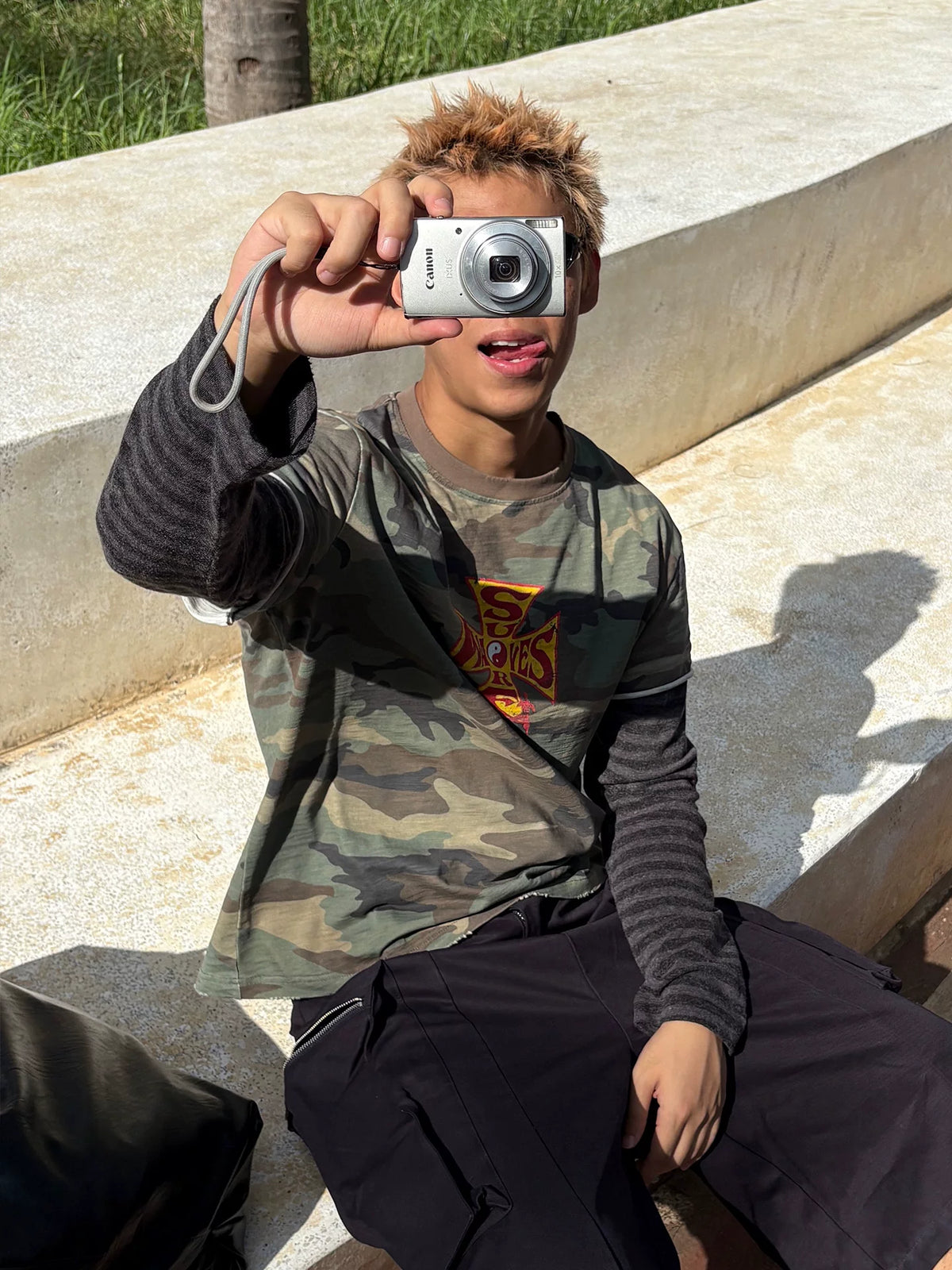 Model wearing the shirt by the seaside, front view