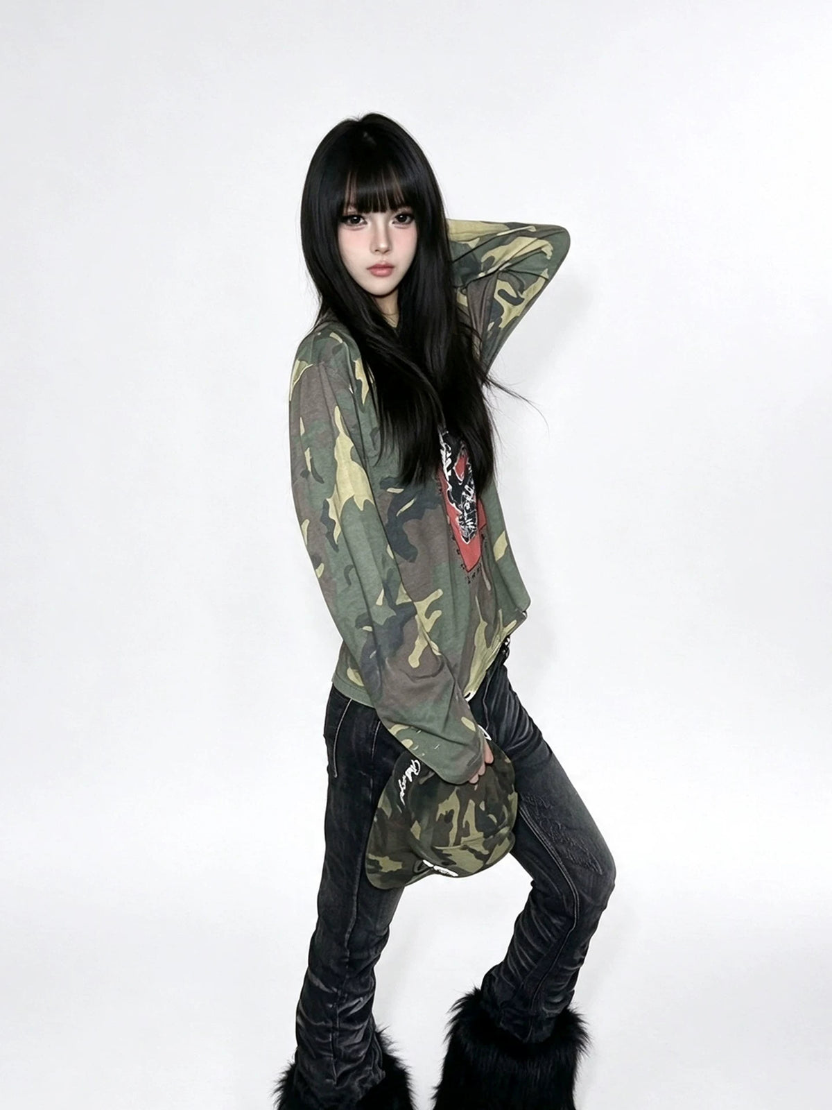 Model wearing the shirt with dark jeans