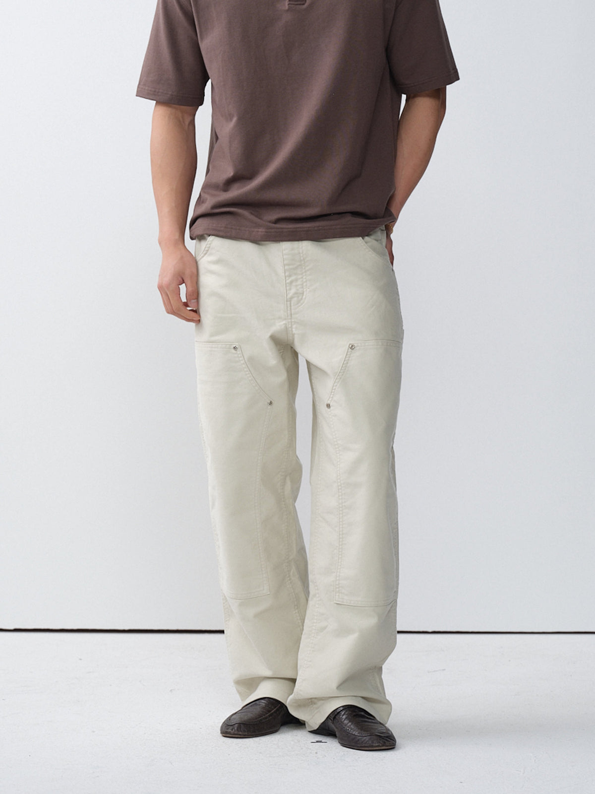Model wearing white cotton moleskin double-knee pants
