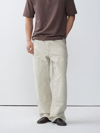 Model wearing white cotton moleskin double-knee pants